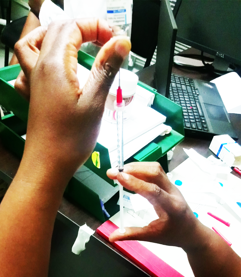 A healthcare worker preparing an injection during HAL treatment training